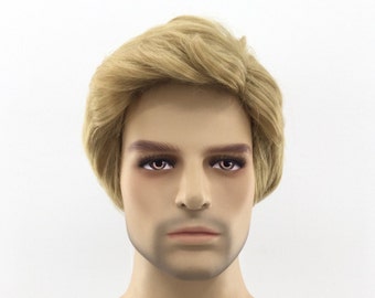 May include: A mannequin head with a light skin tone and short, layered, light blonde hair. The mannequin has brown eyebrows and eyelashes, and a neutral expression. The background is plain white.