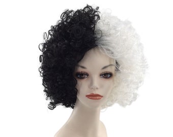 May include: A two-toned wig with black and white curly hair. The wig is styled in a short, voluminous bob. The black side is on the left, and the white side is on the right. The wig is on a mannequin head.