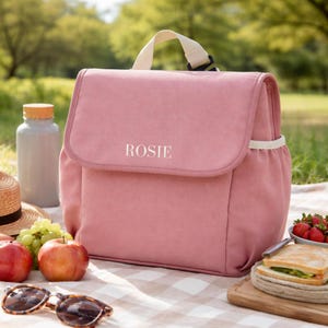 Personalised pink kids lunch bag with name Rosie at picnic