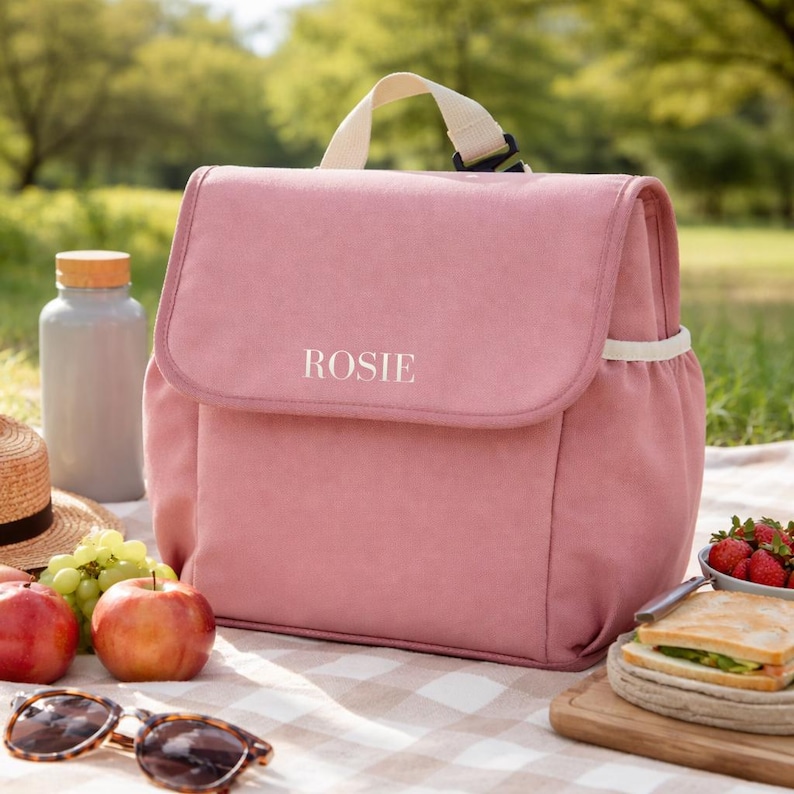 Personalised pink kids lunch bag with name Rosie at picnic
