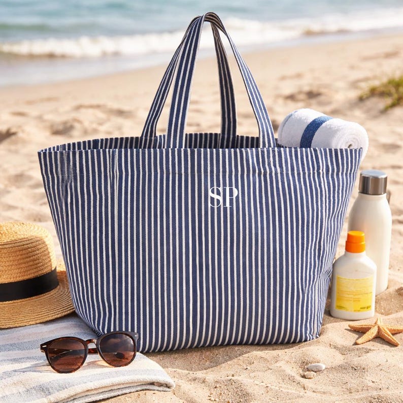 Striped summer bag styled with sunglasses and hat
Personalised holiday tote bag for beach and travel
Large canvas beach bag with striped design