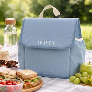 Blue insulated lunch bag with name Oliver and food items