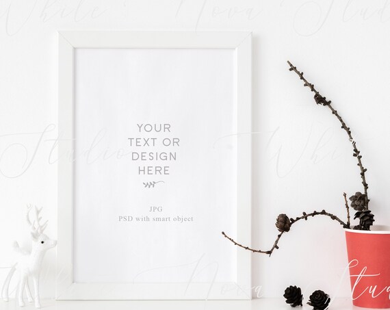Christmas White Frame Mockup With Fawn And Red Paper
