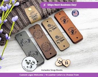May include: A collection of leather tags in various colors, featuring custom logos and text. Some tags read "Handmade by Nana" and "Handmade with Love." Includes snap rivets and wooden heart-shaped buttons. The tags are displayed on a white wooden surface.