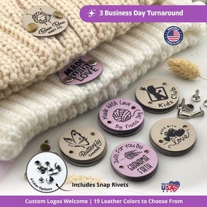 May include: Cream-colored knit hats with various leather tags. The tags feature custom logos and text, including "Made with Love" and "Butterfly Crochet." Includes snap rivets. The image also shows the text "Custom Logos Welcome."