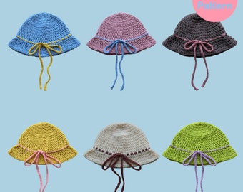 May include: Six crocheted bucket hats with different colored brims and matching ribbon ties. The hats are arranged in two rows of three. The hats are all the same style, but each has a different color combination. The hats are all made with a crochet stitch. The hats are all in focus. The background is a light blue color. The text "bow bucket hat" is at the top of the image. The text "PDF Pattern" is in a pink circle at the top right of the image.