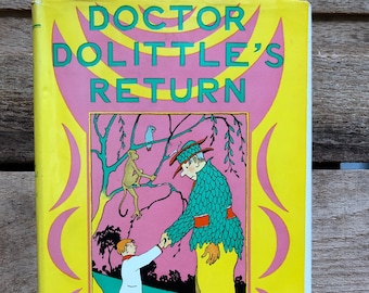 May include: A yellow book cover with the title "Doctor Dolittle's Return" in green and pink lettering. The cover features an illustration of a man in a green and red outfit shaking hands with a boy. There is a monkey in a tree behind them. The author's name, "Hugh Lofting", is printed in a curved arc at the bottom of the cover.