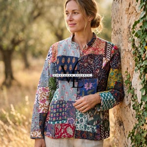 May include: A patchwork jacket with a variety of floral and geometric patterns in shades of blue, red, green, and cream. The jacket has a mandarin collar and button closures. The text "VINAYAKAM EXPORTS" is visible on the jacket.
