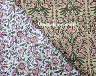 Può includere: Due tessuti a fantasia floreale. Uno è azzurro con fiori e foglie rosa e marroni. L'altro è beige con strisce verticali e fiori rosa e foglie verdi. Il testo "Vinayakamxpeot" è al centro dell'immagine.