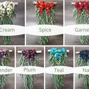 May include: A set of 10 floral wall hangings with different colored flowers and greenery. The colors include cream, spice, garnet, lavender, plum, teal, and navy.
