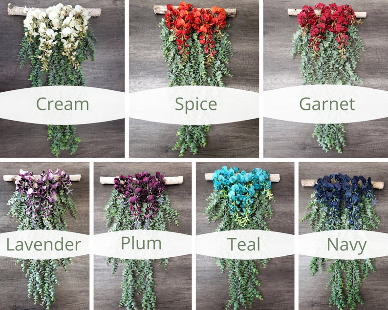 May include: A set of 10 floral wall hangings with different colored flowers and greenery. The colors include cream, spice, garnet, lavender, plum, teal, and navy.