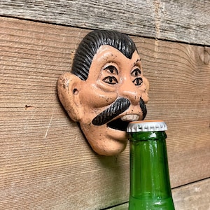 Cast Iron Four Eyed Drunk “Pepe or Machete” Wall Mount Bottle Opener