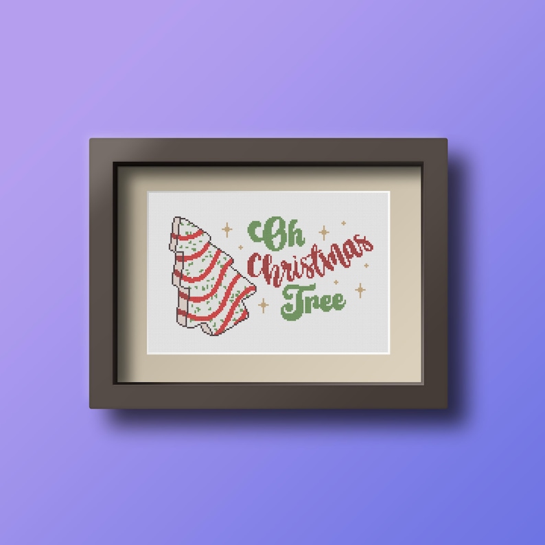 May include: A framed cross-stitch design featuring a stylized Christmas tree with red and white stripes and the text "Oh Christmas Tree" in green lettering.