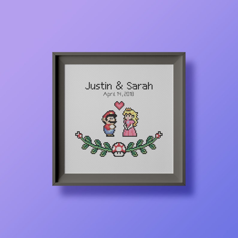 May include: A framed cross-stitch design featuring the video game characters Mario and Princess Peach. The text "Justin & Sarah April 14, 2018" is above the characters.