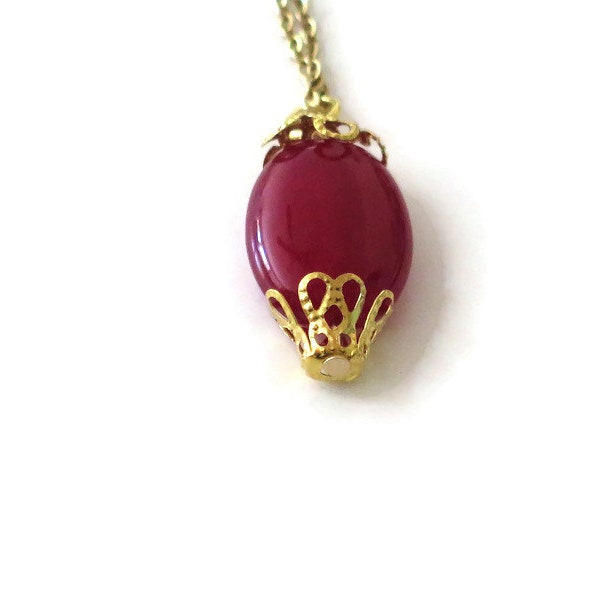 Red glass bead with filigree gold and chain