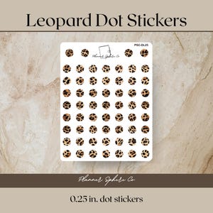 May include: A sheet of leopard print dot stickers. The stickers are small, round, and feature a brown and black spotted pattern. The text "Leopard Dot Stickers" is at the top, and "0.25 in. dot stickers" is at the bottom.