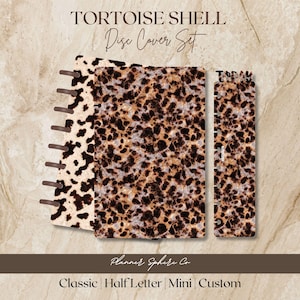 May include: A tortoise shell disc cover set featuring a dark brown and tan leopard-like pattern on two rectangular covers and one narrow bookmark with the word TODAY printed at the top. The covers have circular cutouts along the left edge.