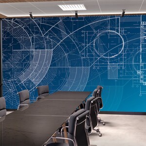 May include: A conference room with a blue wall featuring a white architectural blueprint design. A long black table with black chairs is in the centre of the room.