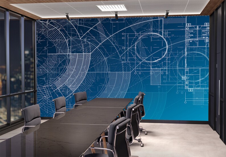 May include: A conference room with a blue wall featuring a white architectural blueprint design. A long black table with black chairs is in the centre of the room.