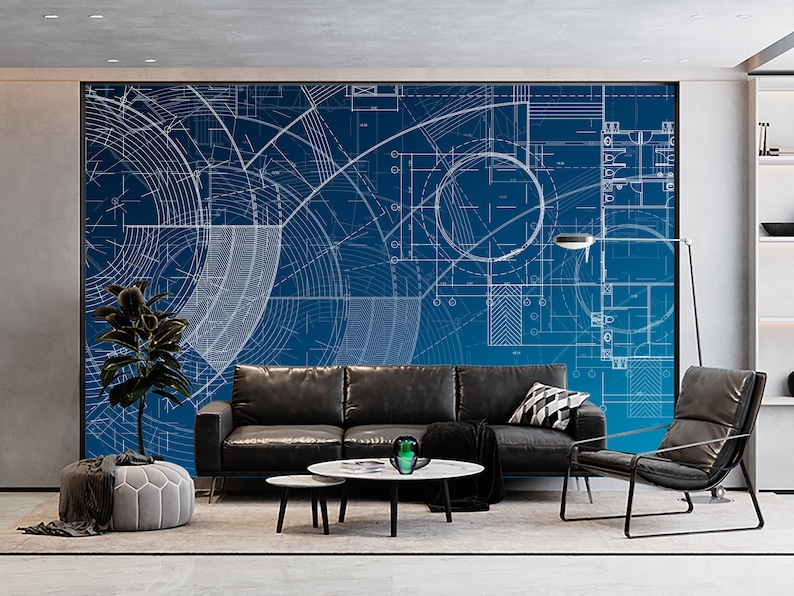May include: A living room interior design featuring a blue and white architectural blueprint patterned wall mural, a black leather sofa, a black leather armchair, a coffee table, a grey pouffe, and a potted plant.