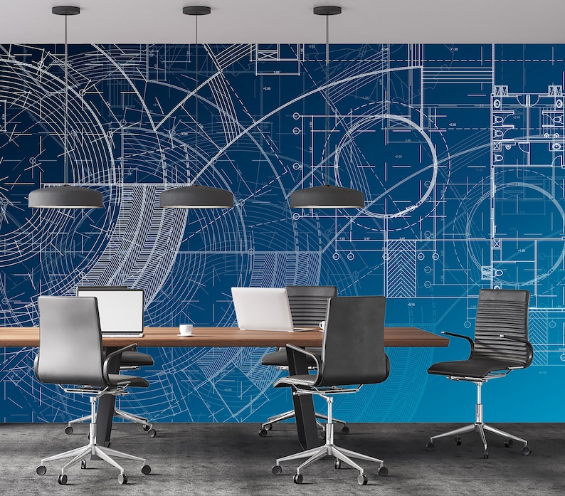 May include: A modern office meeting room with a blue wall featuring a white blueprint design. The room has a wooden table with four black office chairs with wheels.