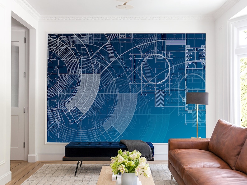May include: A blue and white architectural blueprint design with a gradient background. The design features circles, lines, and geometric shapes. The blueprint is printed on a wall in a living room setting.