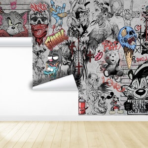 K&ouml;nnte beinhalten: Eine bunte und chaotische Collage aus Comicfiguren und Graffiti-Kunst. Das Bild zeigt Tom und Jerry, einen Sch&auml;del mit einem roten Bandana, eine blaue Hand mit einem Rock'n'Roll-Symbol, einen grauen Elefanten mit roten Kreuzen, einen Teddyb&auml;r mit einem roten Herzen, einen blauen Eisbecher mit einem Sch&auml;del, einen Stinktier mit einem roten Auge und eine Spr&uuml;hdose mit einem roten Teufelskopf. Der Text "REVOLUTION" ist auf dem Bild zu sehen.
