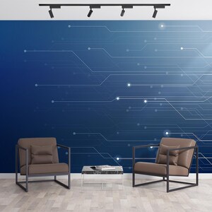 May include: Modern interior design featuring two brown armchairs with black metal frames, a glass coffee table, and a blue wall with a white circuit board design. The room is illuminated by track lighting and has a wooden floor.