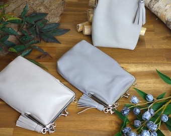 Mobile phone bag for hanging around the shoulder with clip fastener