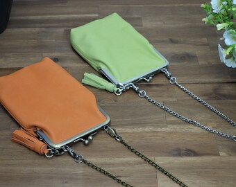 Mobile phone bag for hanging around the shoulder with clip fastener