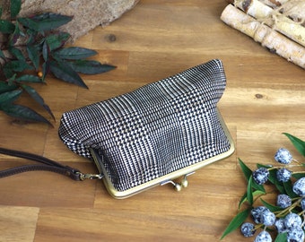 Cosmetic bag made of checked leather, with handle