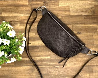 Bum bag made of dark brown leather with snake embossing