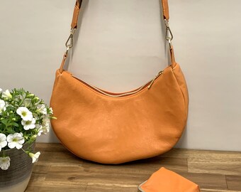 Shoulder bag "Lisa" made of orange leather in crescent shape