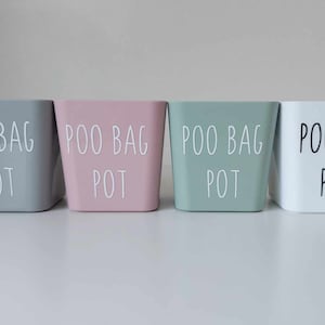 May include: Four square containers with the text "Poo Bag Pot" in white lettering on a grey, pink, green, and white background.