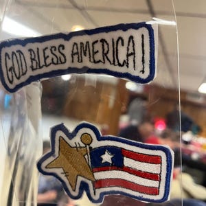 May include: A rustic wooden sign with the text "Welcome to our home" in white lettering. The sign features a distressed finish and a simple, inviting design, perfect for entryway decor.