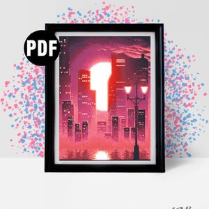 Può includere: Stampa incorniciata di un paesaggio urbano pixelato al tramonto, nei toni del rosa e del rosso. L'opera raffigura un grande sole che tramonta dietro gli edifici. La stampa è etichettata "PDF" e include il testo "Dot's and Spots".