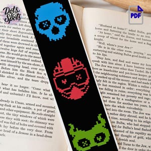 May include: A black rectangular bookmark featuring three pixel art icons arranged vertically. The top icon is a blue skull, the middle icon is a red helmeted figure, and the bottom icon is a green creature face with pointed ears.