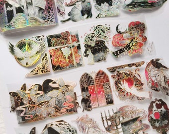 May include: A set of 15 holographic stickers featuring a variety of witchy and magical designs. The stickers are on a clear background and have a glittery finish. Some of the designs include a cat, a cauldron, a book, a gate, and a hand holding an apple.