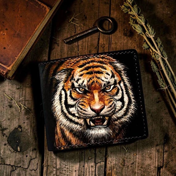 A hand-tooled 3D carved leather tiger bifold — the kind of wallet that stops people mid-conversation when you pull it out.