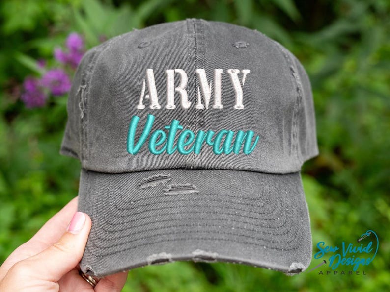 May include: A gray distressed baseball cap with the text "ARMY Veteran" embroidered in white and teal.