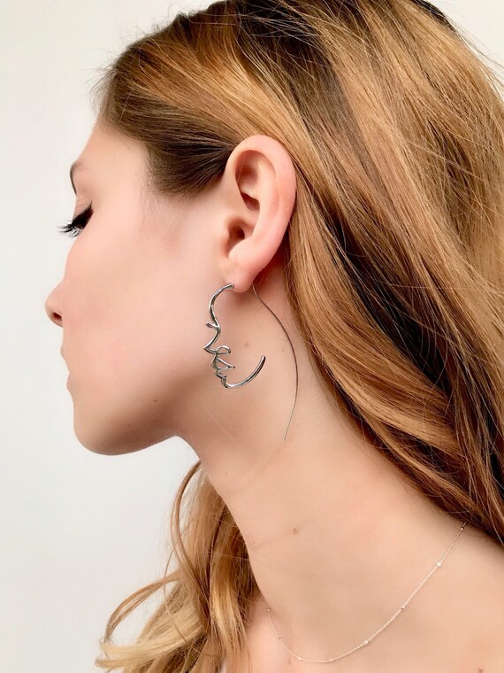 Minimalist shop face earrings