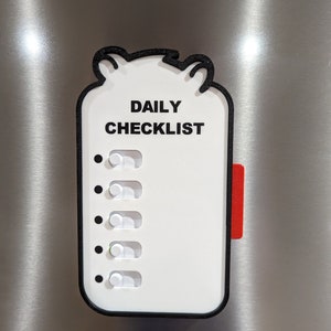 May include: White daily checklist with black border and text, "DAILY CHECKLIST." Features five toggle switches and a red tab. The checklist has a bear-shaped top and is mounted on a metallic surface.