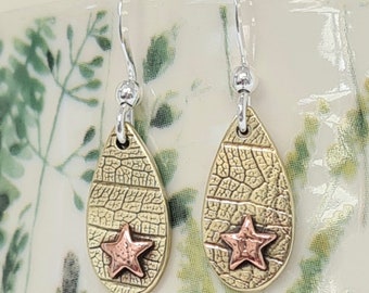 Tiny Copper & Brass Star Drop earrings. Handmade leaf print and teardrop shape design.
