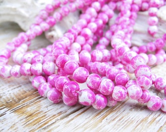 25 marbled glass beads pink white 6 mm
