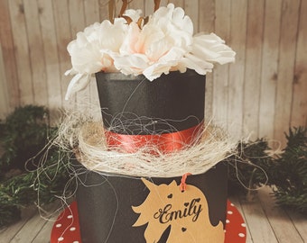 Beautiful diaper cake in black and red with beautiful peonies girls with a unicorn motif in a vintage look