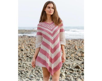 May include: A pink and white crochet tunic with a chevron pattern. The tunic has three-quarter sleeves and a v-neck. The Drops Design logo and website address are visible in the lower portion of the image.
