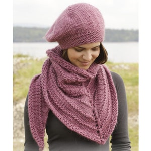 May include: A pink knitted beret and matching triangular shawl. The shawl has a textured stitch pattern. DROPS DESIGN. www.garnstudio.com