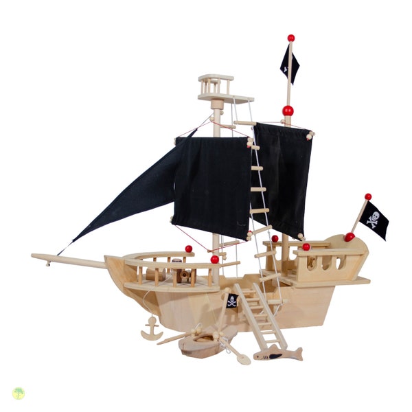 Bateau pirate en bois avec beaucoup d'accessoires et voiles noires