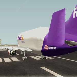 May include: A white FedEx Express cargo plane with purple tail fins and the FedEx logo on the side. The plane is on a runway with the tail number N440ST visible.