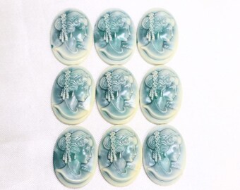 Lot of 9 Green Patinaed Faux Cameo Cabochons - Early 1970's